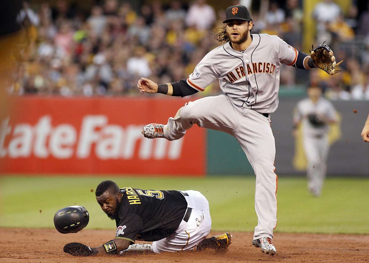 Brandon Crawford, shown in full flight as a top defensive shortstop, got a painful injury at the worst possible time. (Photo by Justin K. Aller/Getty Images)
