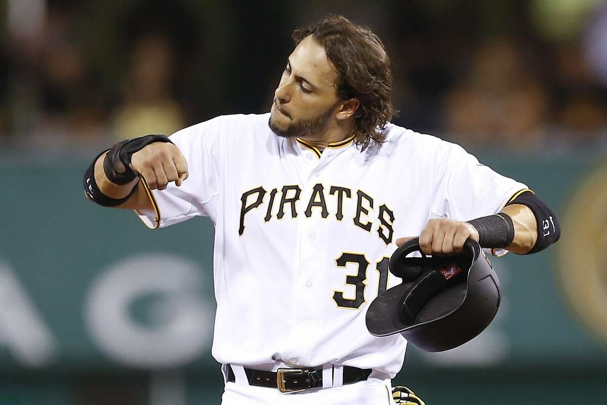 Pittsburgh Pirates' Michael Morse pumps his arms and kicks his feet up Neil Walker's single moved him up to second base in the eighth inning of a baseball game between the Pittsburgh Pirates and the Arizona Diamondbacks, Monday, Aug. 17, 2015, in Pittsburgh. The Diamondbacks won 4-1. (AP Photo/Keith Srakocic)