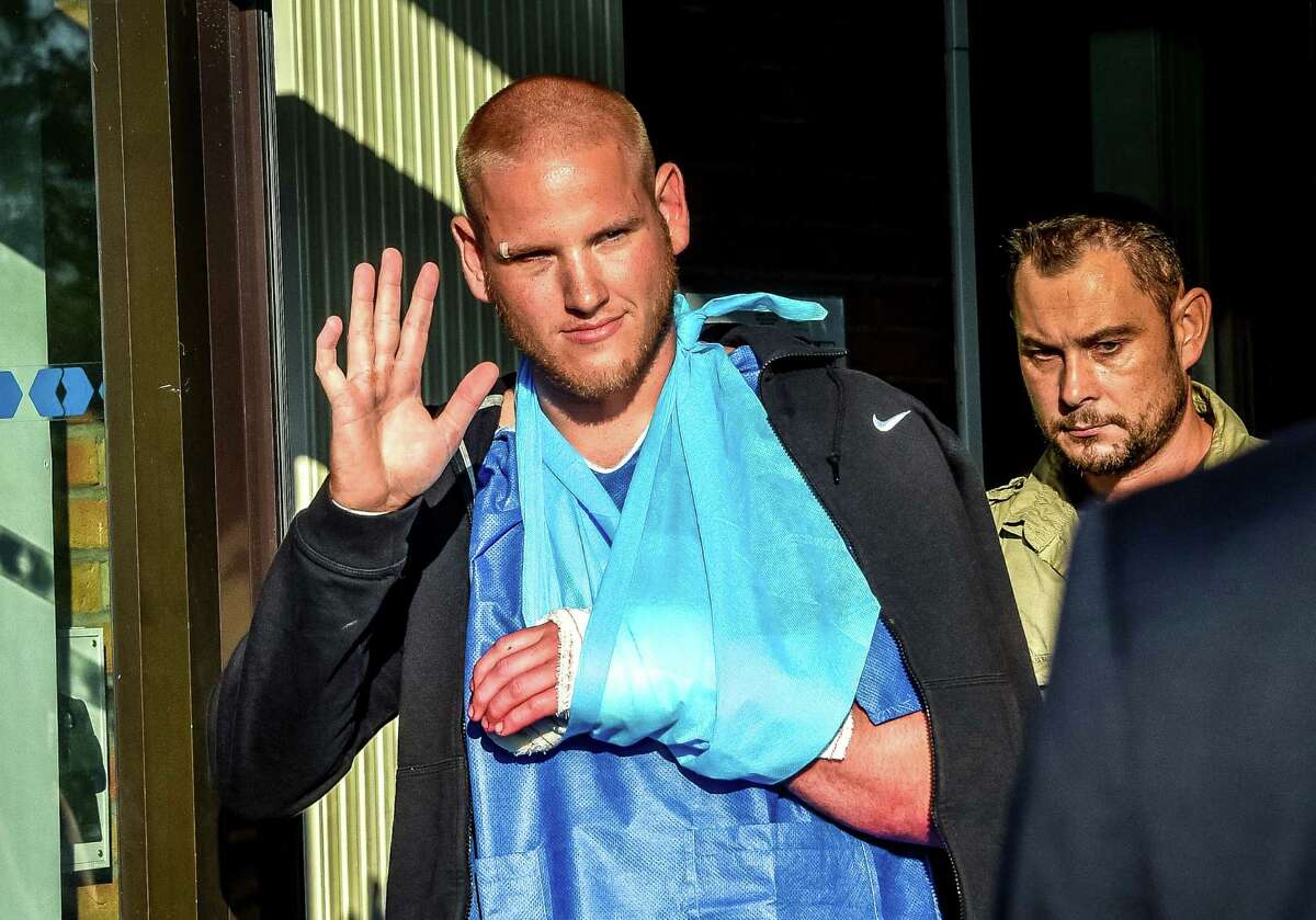 Off-duty U.S. Airman 1st Class Spencer Stone leaves a hospital in northern France after being treated for cuts the train gunman inflicted with a box cutter. Stone was the first man who jumped the gunman.