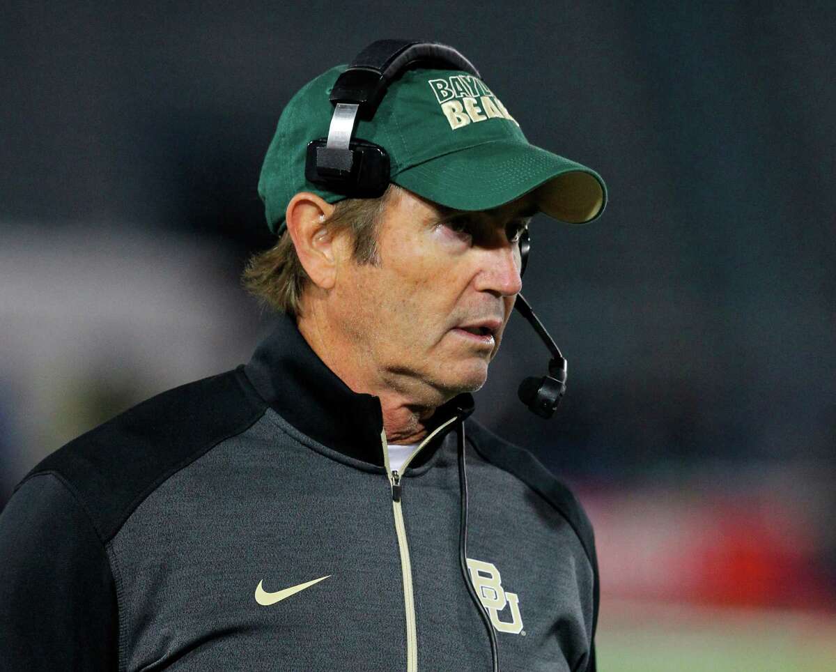 FILE - In this Sept. 12, 2014, file photo, Baylor coach Art Briles walks the sideline during his team's NCAA college football game against Buffalo in Amherst, N.Y. Baylor University will conduct an investigation into the school's handling of sexual assault allegations against a football player who was allowed to transfer into Briles' program despite a history of disciplinary problems at Boise State. Following the conviction of defensive end Sam Ukwuachu on sexual assault charges, Baylor President Ken Starr on Friday, Aug. 21, 2015, called for a "comprehensive internal inquiry into the circumstances associated with the case and the conduct of the offices involved." (AP Photo/Bill Wippert, File)
