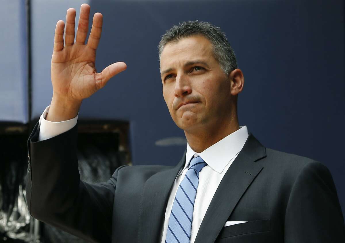 Retired New York Yankees pitcher Andy Pettitte waves to fans as he is introduced from the bullpen during a pregame ceremony retiring his number before a baseball game in New York, Sunday, Aug. 23, 2015. The Yankees retired Pettitte's No. 46 Sunday. (AP Photo/Kathy Willens)