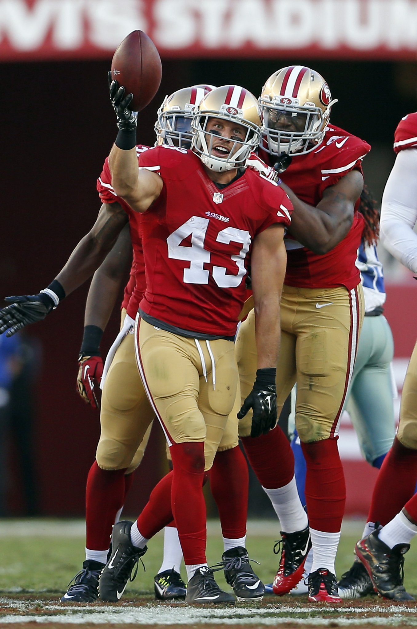 49ers defensive back L.J. McCray tries to prevent a punt from