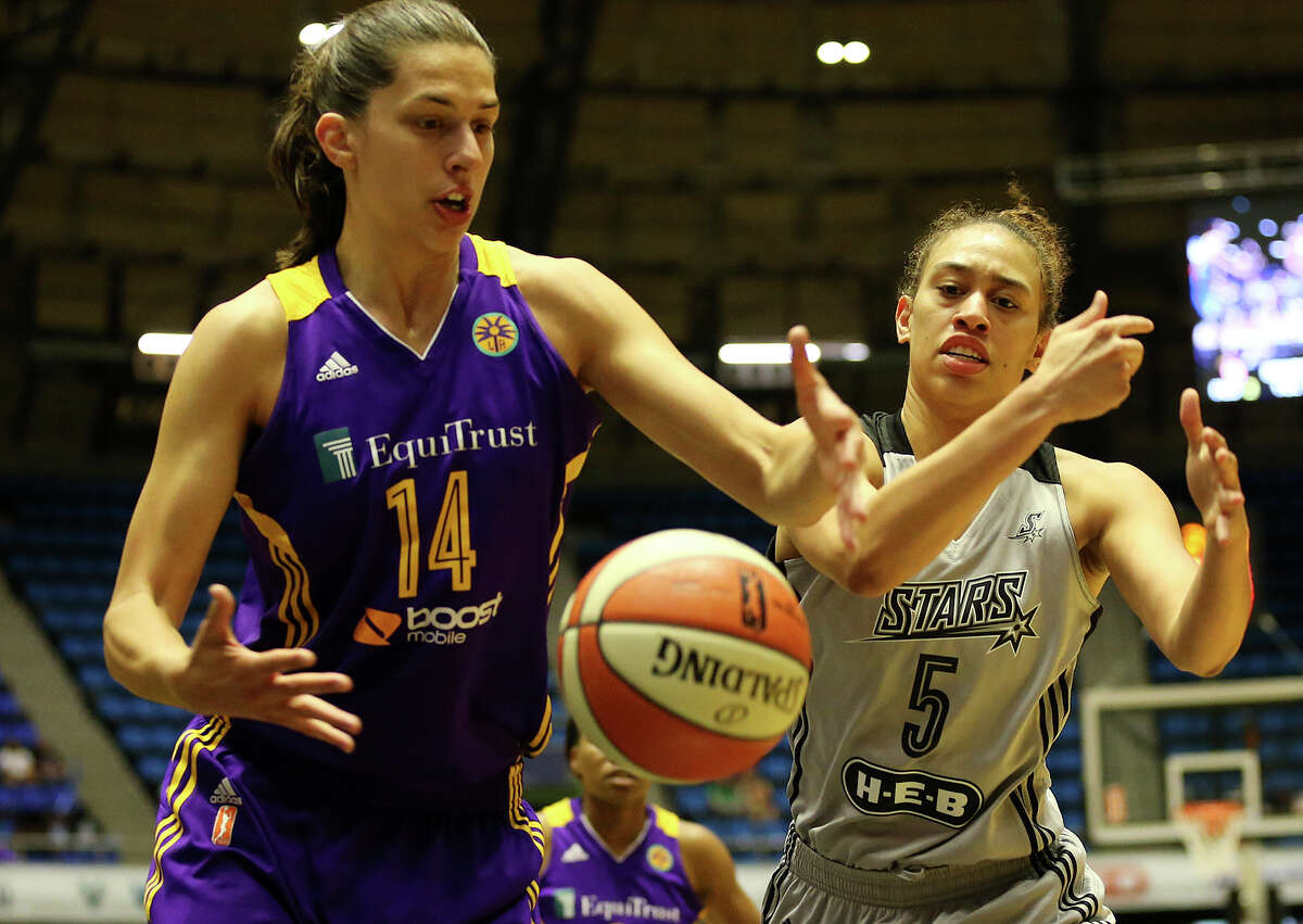 Los Angeles Sparks' Marianna Tolo and San Antonio Stars' Dearica Hamby can't get their hands on a rebound during the first half at the Freeman Coliseum, Sunday, August 23, 2015.