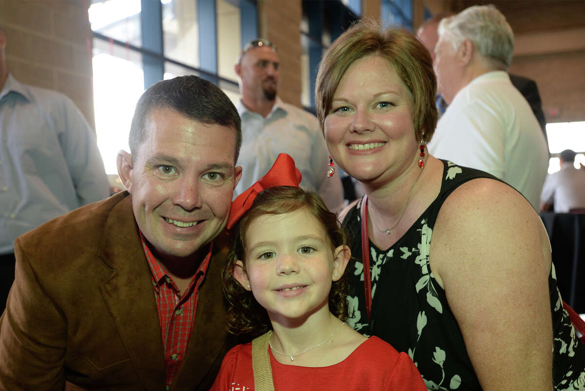 Ben Beasley, Sarah Beasely, 6, and Ellen Beasley during Lamar's football banquet at Ford Park Sunday night. Photo taken Sunday, August 23, 2015 Guiseppe Barranco/The Enterprise