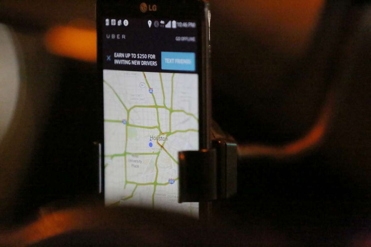 The Uber app is seen as Shirley Fuller drives during her shift Friday, Aug. 7, 2015, in Houston. Fuller was laid off from her job at a valve manufacturing company March 25. She is one of a growing number of people who struggle to earn enough money as low oil prices push energy companies to lay off workers. ( Jon Shapley / Houston Chronicle )