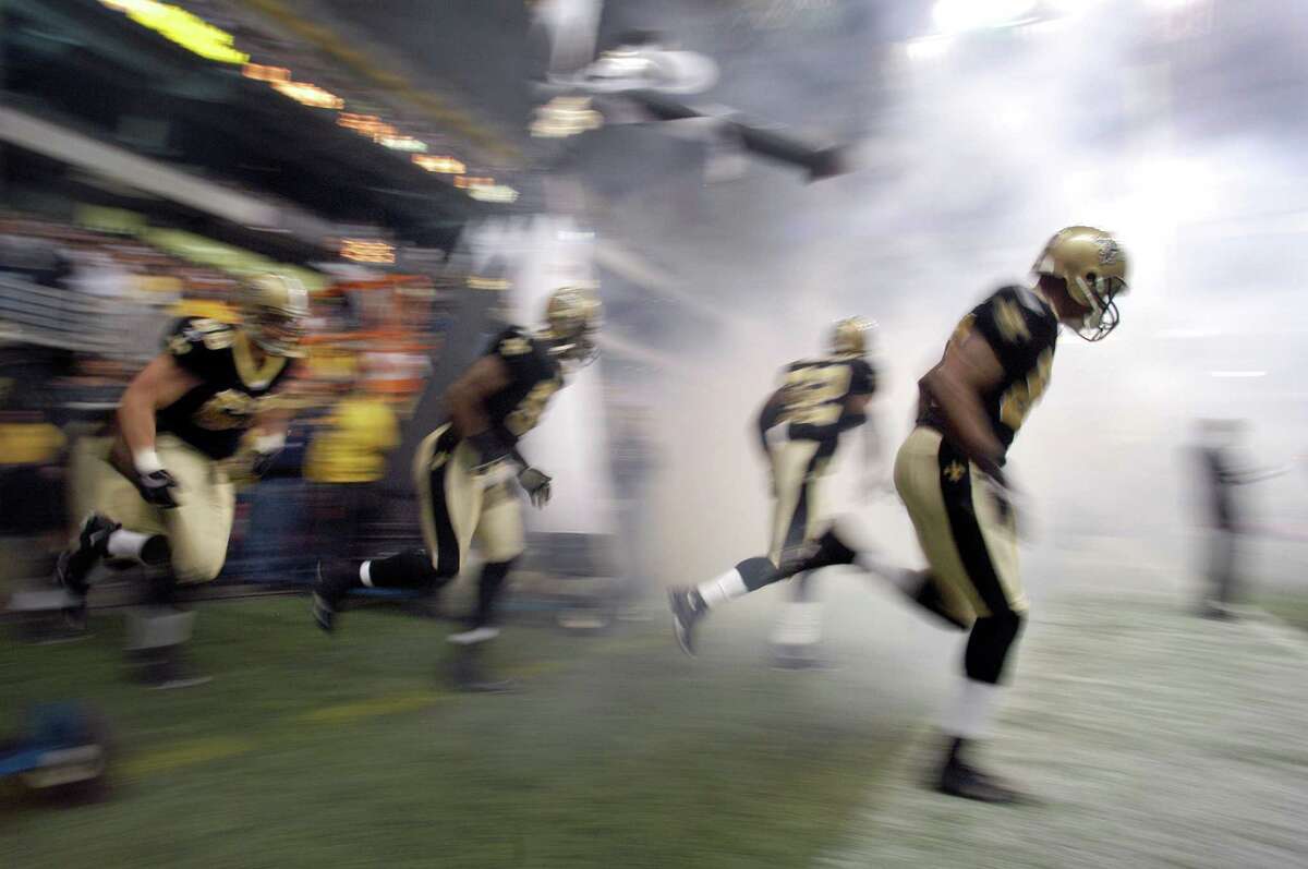 The New Orleans Saints take the field before a game between the New Orleans Saints and the Detroit Lions at the Alamodome, Dec. 24, 2005. The Saints were defeated 13-12.
