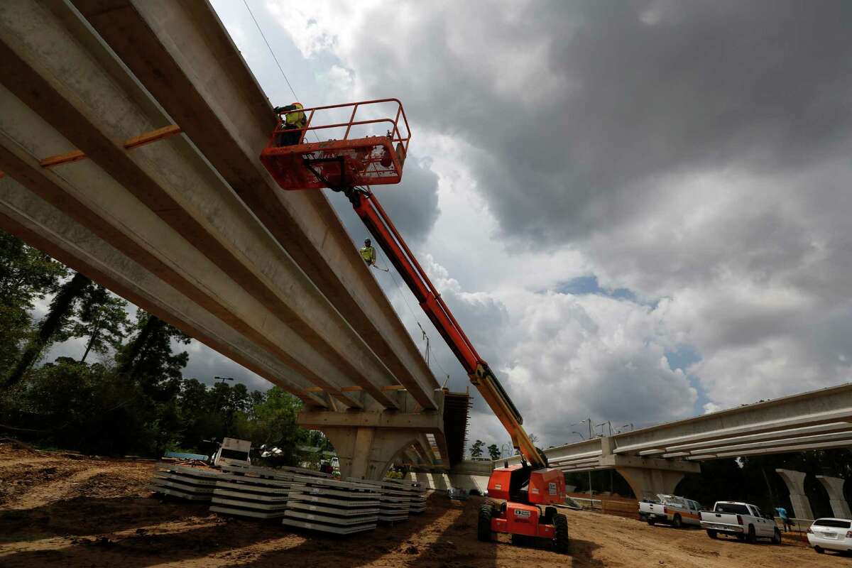 Workers work on a ramp from the Hardy Toll Road on Aug. 19 in Houston. The Hardy hasn't seen significant improvement in 30 years or so, but with growth and the Grand Parkway it is time for a major rehab, officials said.