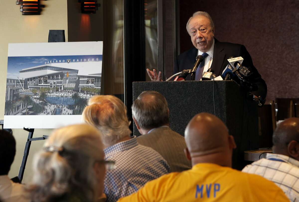 Developer, Floyd Kephart, next to an artist's conception of what the project may look like, discusses the details of his plan for Coliseum City during a public meeting in Oakland, Calif., on Tues. August 25, 2015.
