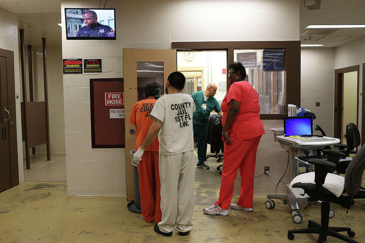 A trustee trims the hair of an inmate in the Bexar County Jail mental health unit, Tuesday, August 11, 2015. The unit was remodeled after officials at the jail commissioned a report from national suicide prevention expert, Lindsay Hayes in 2010. In the 2009, suicides at the jail were three times the national average, prompting the report.