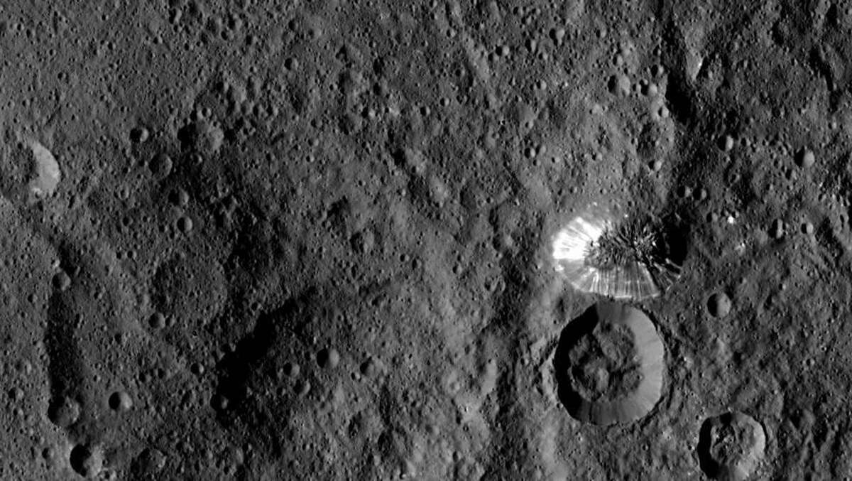 NASA's Dawn spacecraft spotted this tall, conical mountain on Ceres from a distance of 915 miles (1,470 kilometers). The mountain, located in the southern hemisphere, stands 4 miles (6 kilometers) high. Its perimeter is sharply defined, with almost no accumulated debris at the base of the brightly streaked slope.
