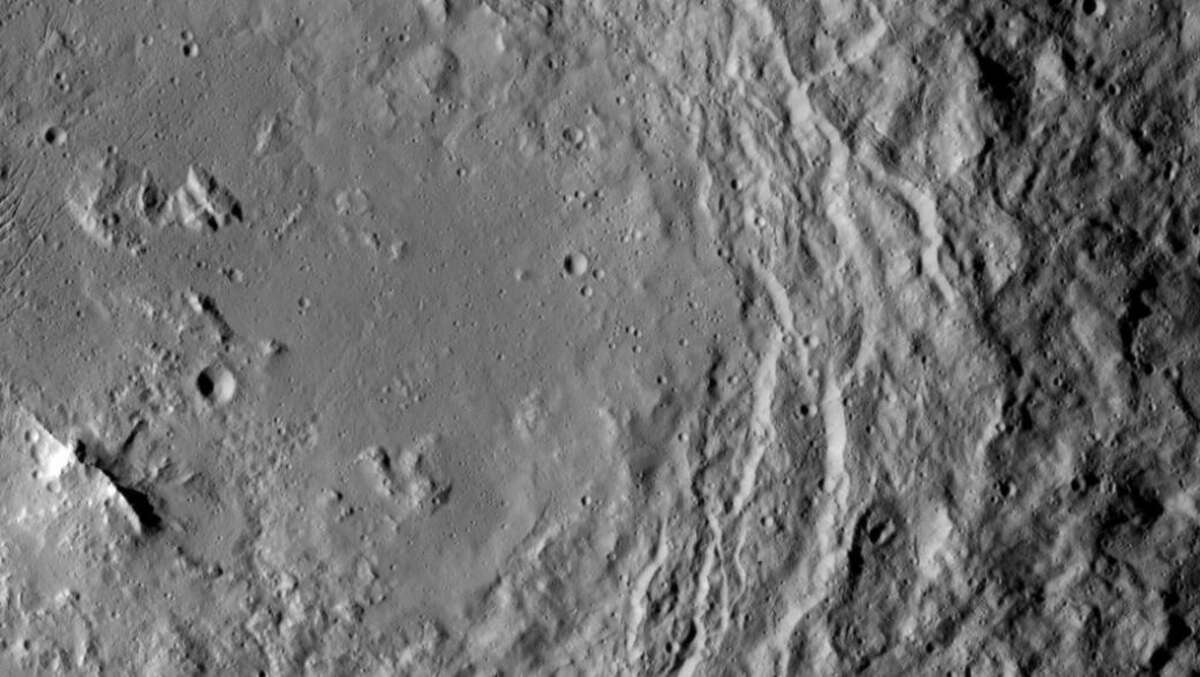 NASA's Dawn spacecraft took this image that shows a mountain ridge, near lower left, that lies in the center of Urvara crater on Ceres.