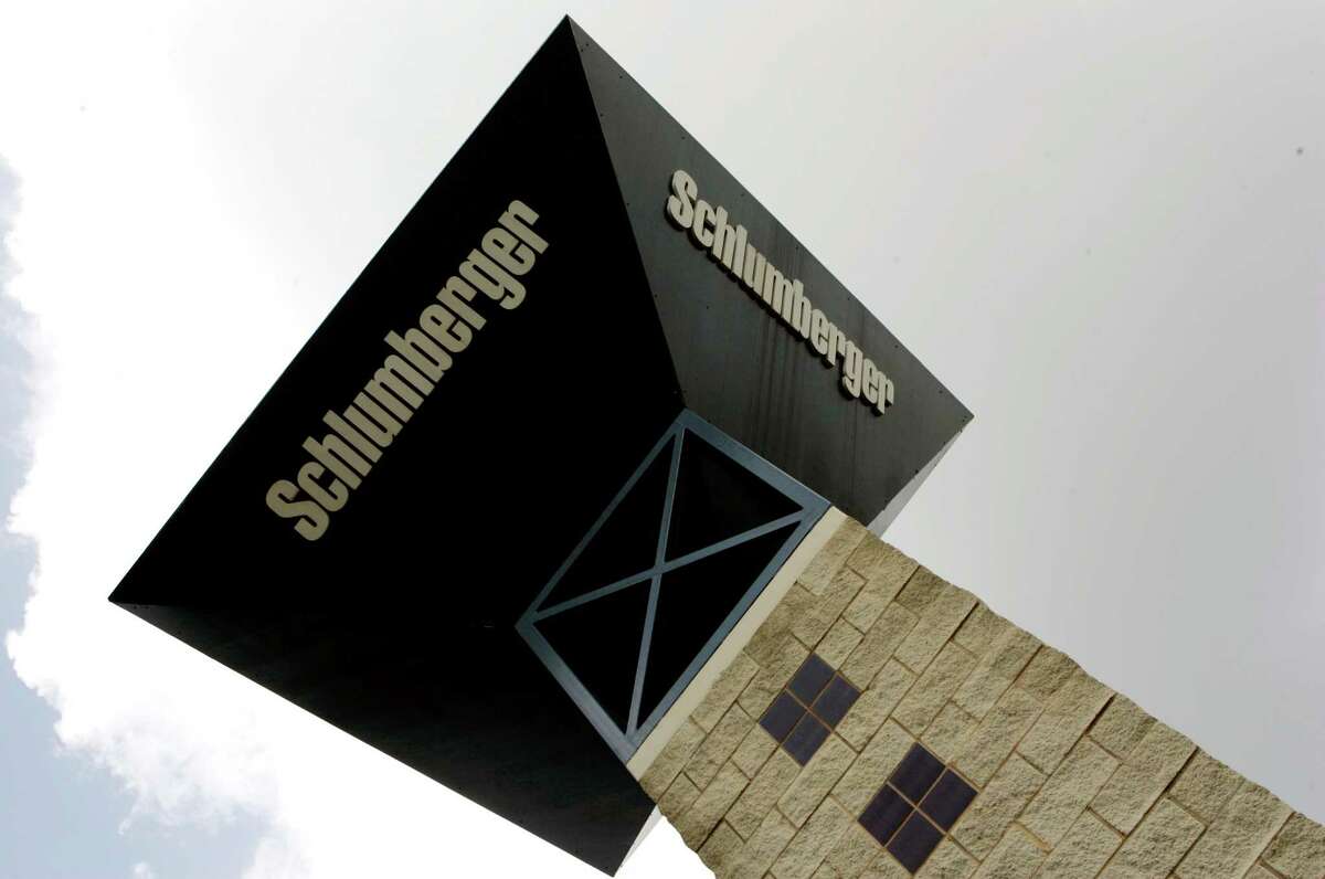 Schlumberger, which displays its logo on a tower at its campus in Sugar Land, plans further layoffs amid a continuing oil price downturn. (AP Photo)