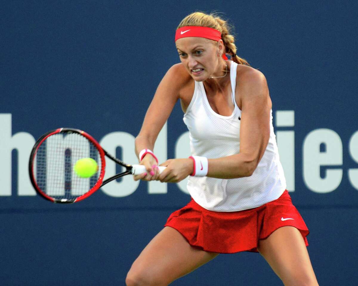 Defending champion Petra Kvitova returns the ball as she plays against Agnieszka Radwanska, during Connecticut Open tennis action in New Haven, Conn. on Thursday August 27, 2015.