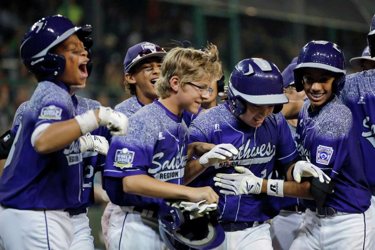 Pearland﻿'s Zack Mack, second from right, celebrates with teammates after he hit a grand slam ﻿during the first inning of a U.S. elimination ﻿game at the Little League World Series﻿.
