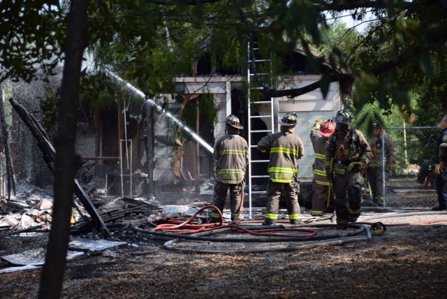 Neighbor helps woman escape fire at West Side home