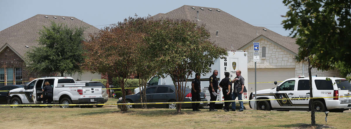 The Bexar County Sheriff's Department investigates Friday August 28, 2015 at the scene of an officer involved shooting in Northwest Bexar County on the 24,000 block of Walnut Pass near Boerne Stage Road. Deputies arrived at the scene of a domestic disturbance there where at least one officer opened fire on Gilbert Flores. Flores was flown to an area hospital where he died later.