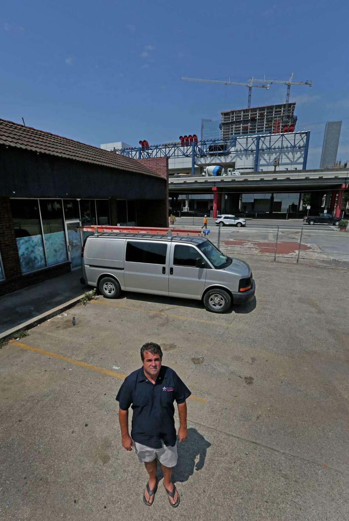 Wesley Jurena poses for a portrait Wednesday, Aug. 26, 2015, in Houston. He is opening his first brick-and-mortar Pappa Charlie's Barbeque, 2012 Rusk, just east of downtown. He's leasing space in a strip center that could be acquired and demolished by TxDOT for a massive highway rebuilding project, a portion of which calls for removing the Pierce Elevated and realigning I-45 to be parallel to Interstate 10 and U.S. 59 near downtown ( Steve Gonzales / Houston Chronicle )