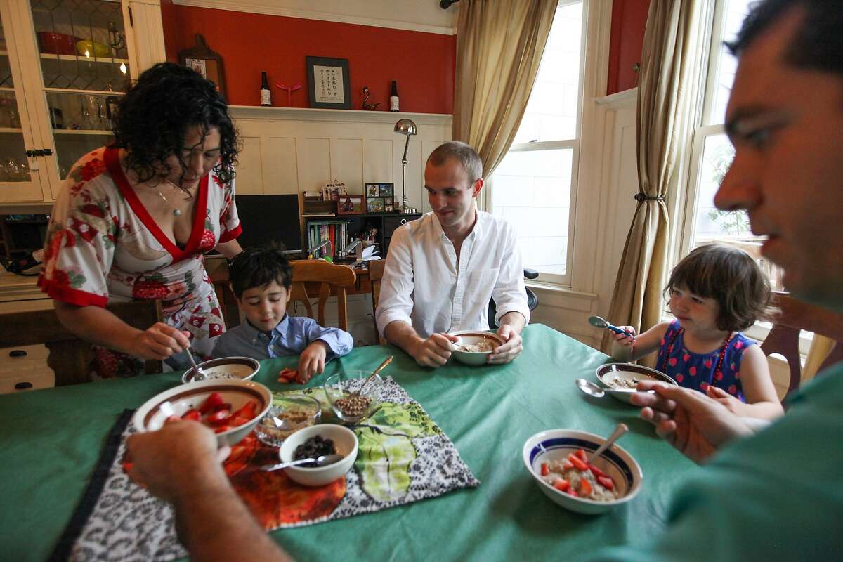 (l-r) Kim Jacoby, Max Jacoby, Brett Davis, Olivia Jacoby and David Jacoby share a morning breakfast at the Jacoby's house in San Francisco, California, on Friday, Aug. 28, 2015. Brett Davis, is a guest, who's staying in the Jacoby's Airbnb. Proposition F, the ballot initiative to rein in short-term rentals, would make it easier for neighbors to sue other neighbors, like the Jacoby's for hosting Airbnb guests.