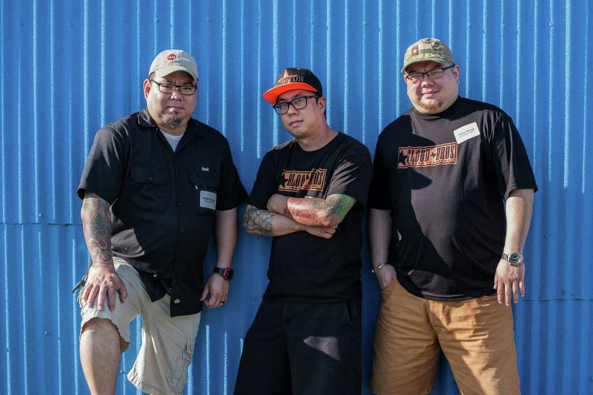 Pitmasters Robin Wong, Quy Hoang and Terry Wong of Blood Bros Barbecue pose for a portrait outside Pizzitola's BBQ during a happy hour ahead of the 3rd Annual Houston Barbecue Festival Monday April 13, 2015. Blood Bros Barbecue along with many other barbecue pitmasters will participate in the festival scheduled for April 26, 2015. (Michael Starghill, Jr.)