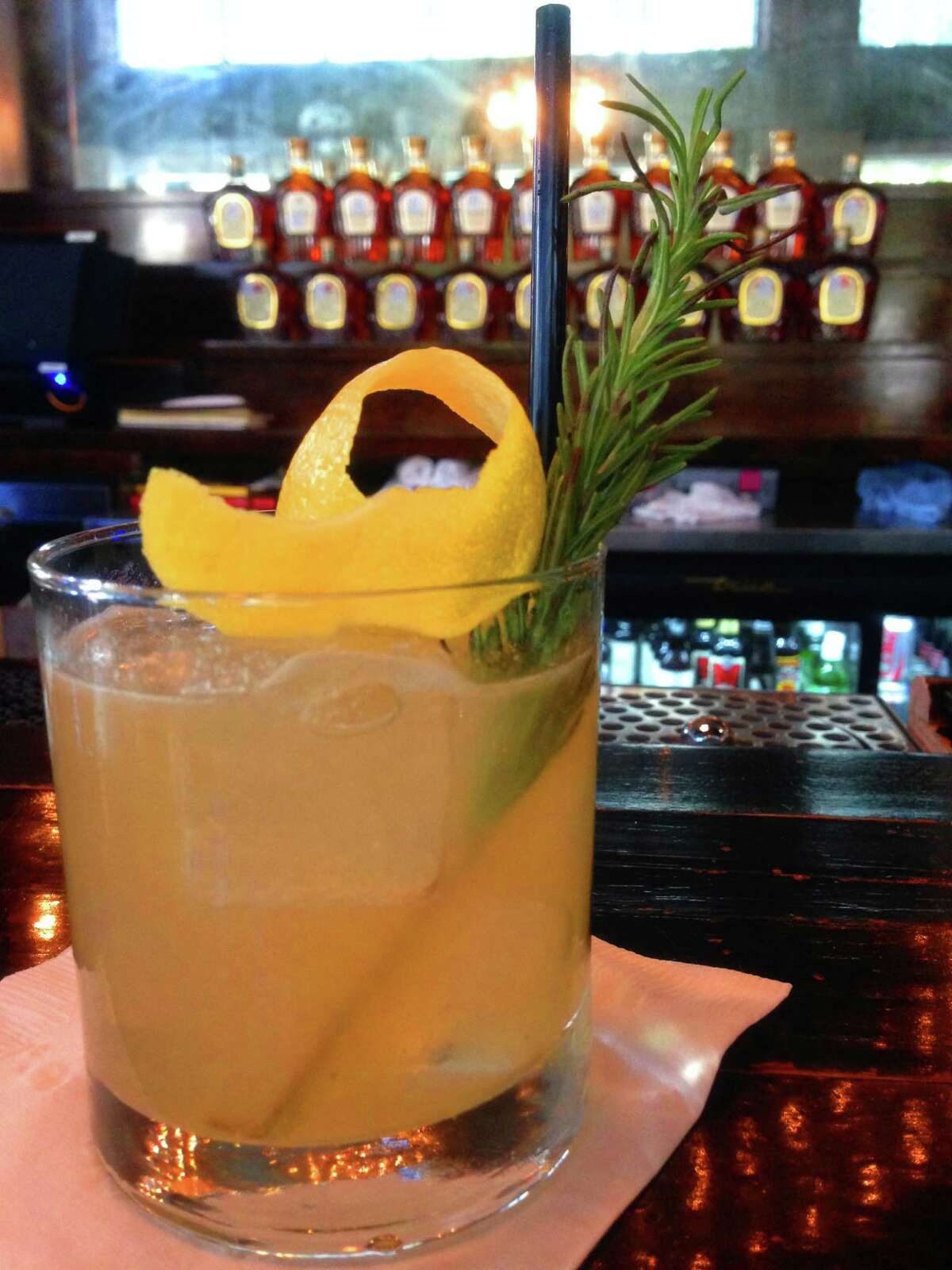 Coal Miner's Daughter is a cocktail made with Crown Royal Northern Harvest Rye, lemon juice, honey and a rosemary sprig.