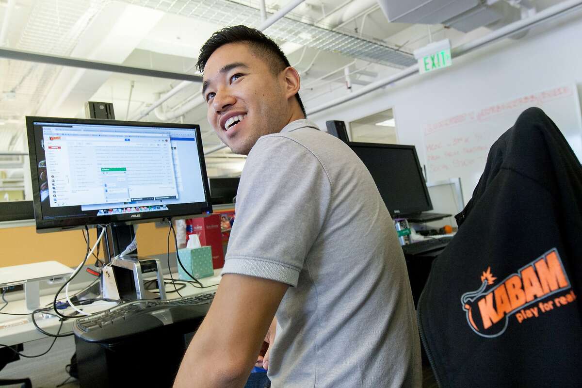 Jason Zhu, Kabam's head of UA partnerships, works at his desk, Friday, Aug. 28, 2015, in San Francisco, Calif.