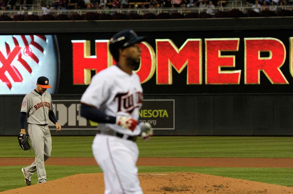 Astros starting pitcher Scott Kazmir can't stand to watch as the Twins' Eduardo Nunez rounds the bases after hitting a solo home run in the third inning.