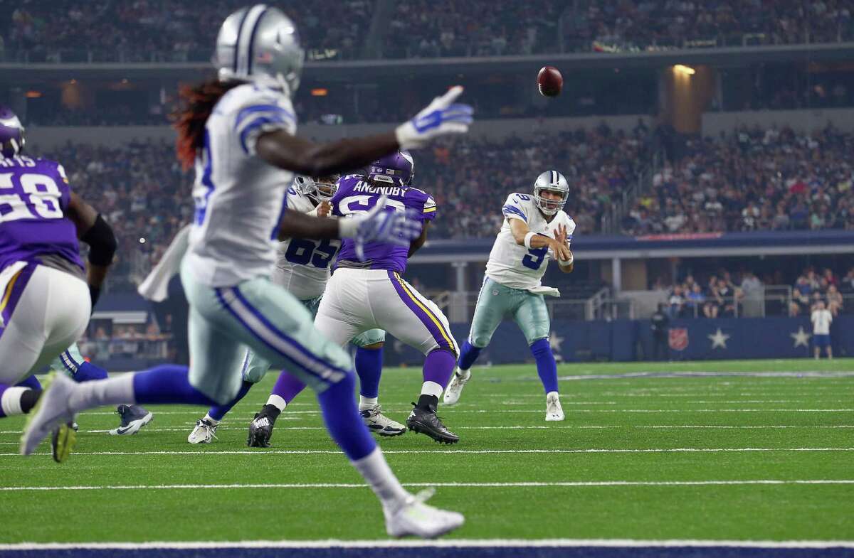 Cowboys receiver Lucky Whitehead, foreground, waits to receive a touchdown pass from Tony Romo, who threw for two scores against the Vikings.﻿