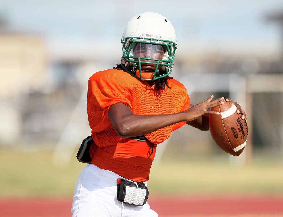 Sam Houston quarterback Raymonte Prime looks for a receiver during a practice session at the school on Tuesday, August 18, 2015.