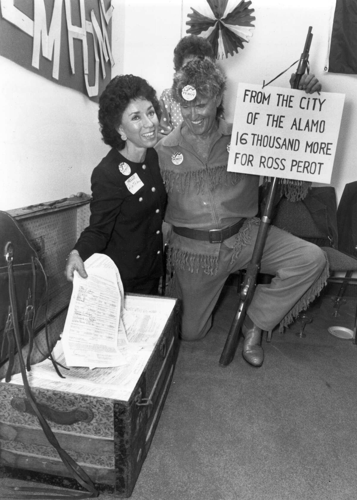 Then and Now 102702 - FILE - cutline: Local Ross Perot supporters Kathleen Carter and A.J. Myers pose with petitions bearing 16,000 signatures to put Perot on the presidential ballot in Texas, in this 1992 file photo. Today, Carter is chairwoman of the Alamo Committee of the Daughters of the Republic of Texas, the group entrusted by the state to care for the Alamo. Kathleen Carter and A.J. Myers with the Perot petitions as they were being packed to be transported to Dallas. Petitions to put Ross Perot on the Ballot as a presidential candidate. May 1 , 1992 photo by Jose Barrera / Staff