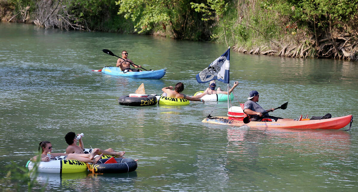 Tubers and kayakers float the San Marcos River while attending Float Fest held at Cool River Ranch Sunday Aug. 30, 2015 in Martindale, Tx.