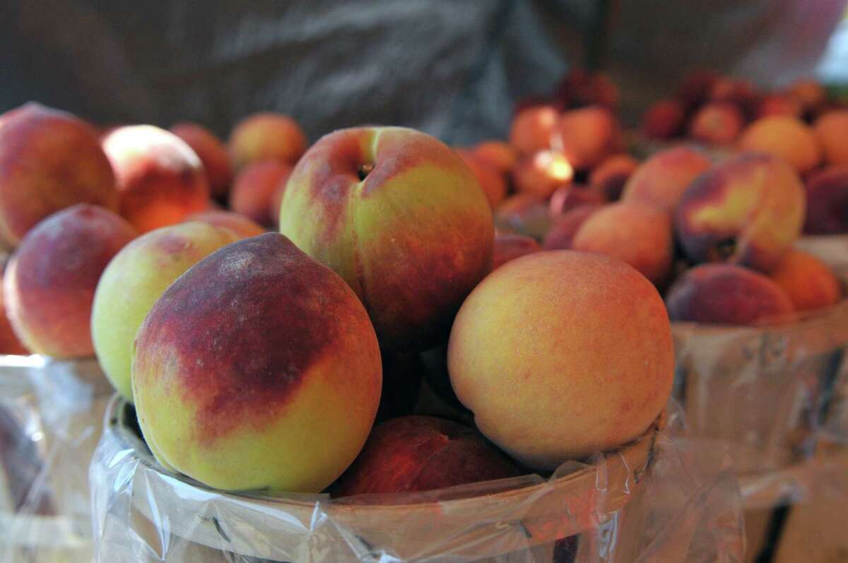 A view of Red Haven peaches for sale on Tuesday, Aug 18, 2015, at Love Apple Farm in Ghent, N.Y. The farm is still recovering from a fire that leveled its store and refrigerated warehouse in 2012. (Phoebe Sheehan/Special to The Times Union)