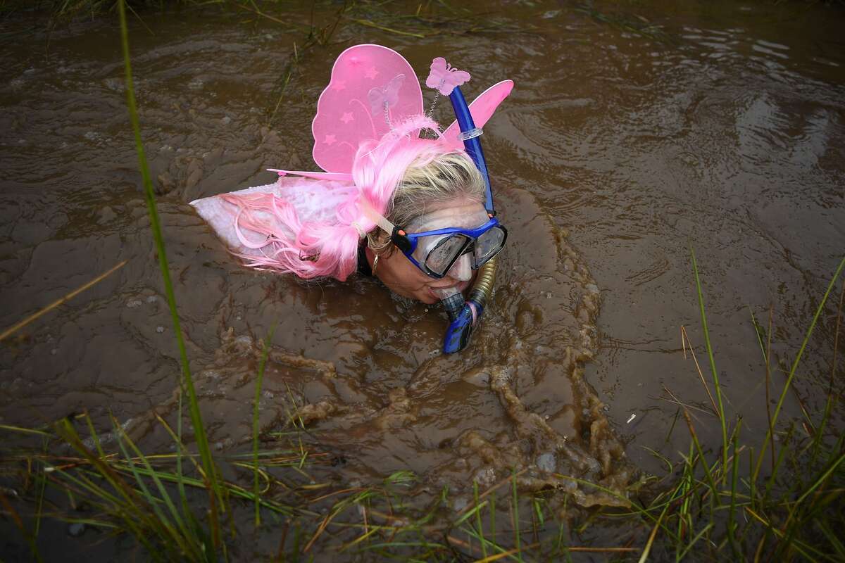 A competitor dressed in a fairy costume takes part in the 30th World Bog Sn...