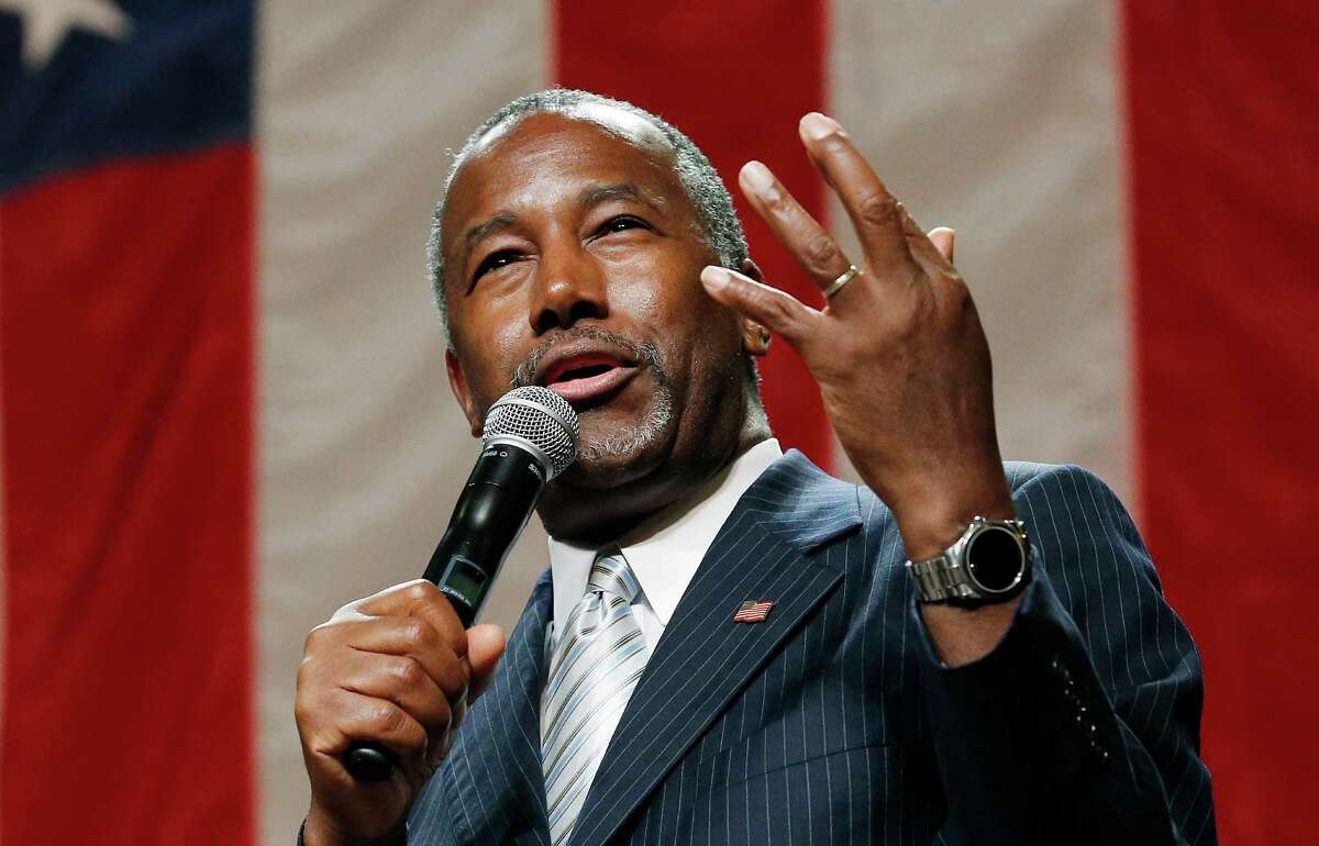 Republican presidential candidate Ben Carson delivers a speech to supporters Aug. 18 in Phoenix. His positives far outshine another outsider in the race — Donald Trump, who has mostly negatives.