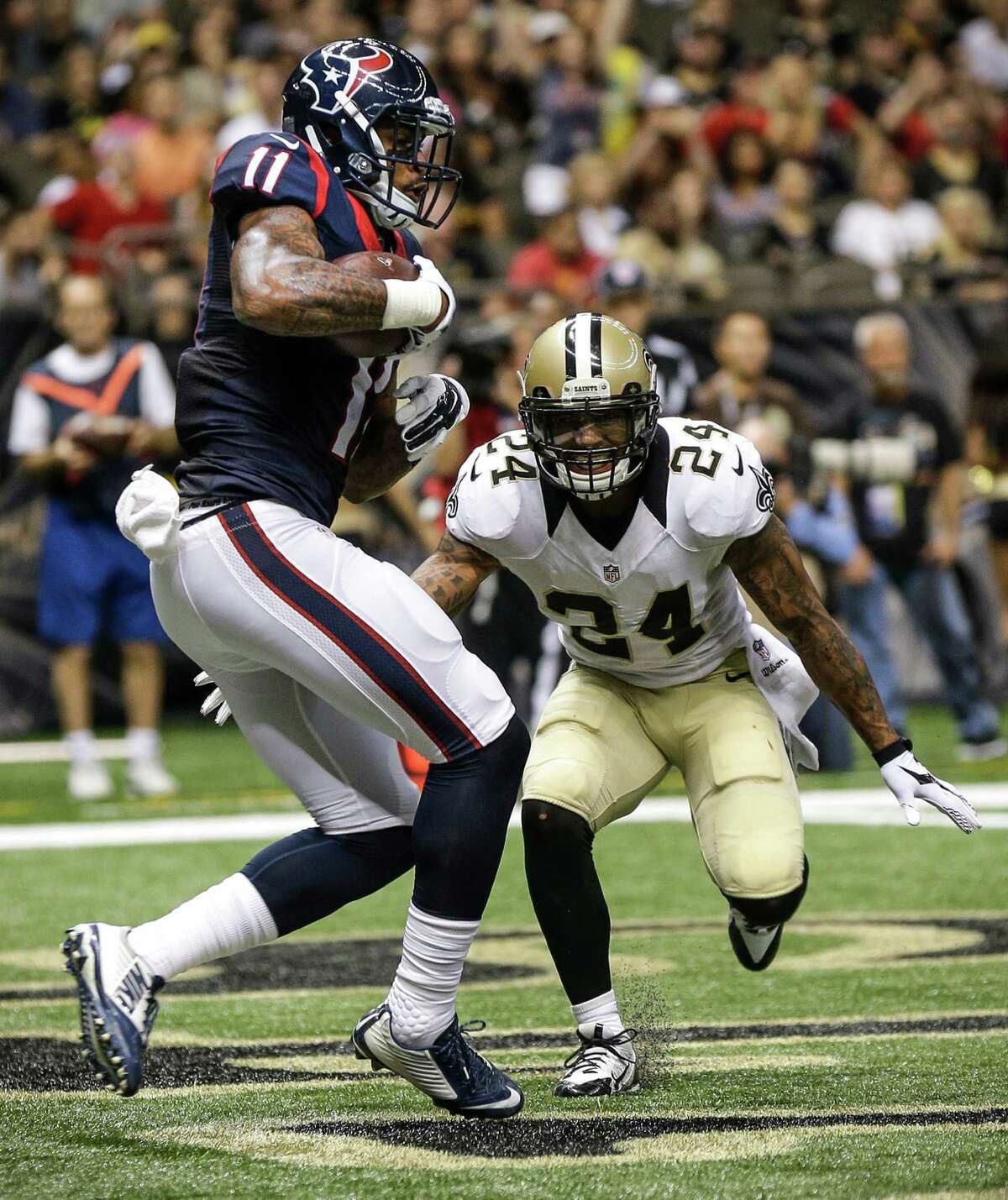 Texans rookie Jaelen Strong beats the Saints' Kyle Wilson for a touchdown catch Sunday.