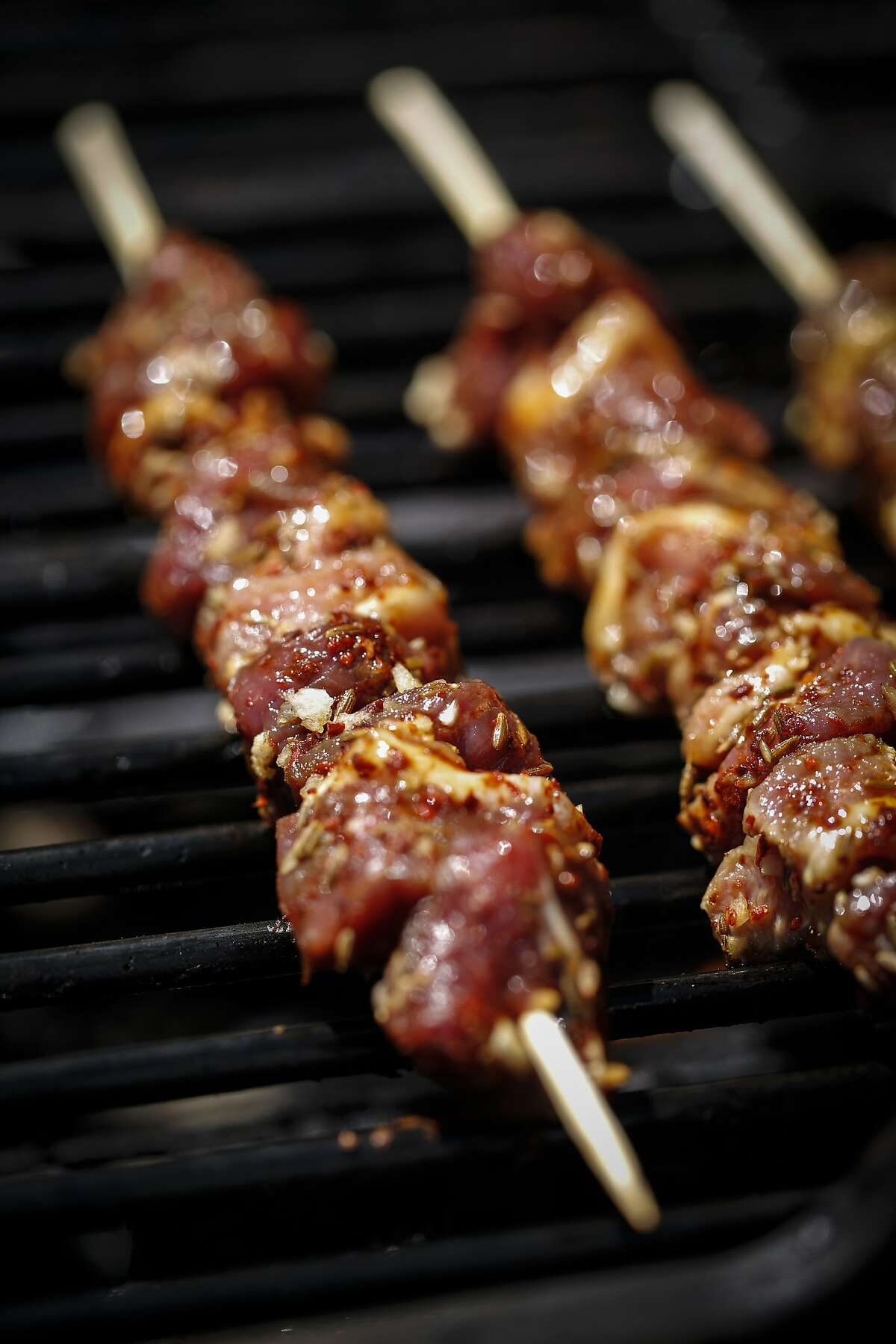 Lamb skewers dusted with chiles, cumin and garlic are seen on Thursday, Aug. 27, 2015 in San Francisco, Calif.