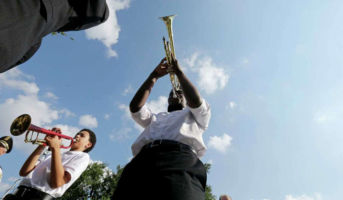 Musicians lead the procession during a wreath laying ceremony at the Hurricane Katrina Memorial on the 10th anniversary of Hurricane Katrina in New Orleans. The Big Easy seems to be coming back, slowly, but a reader rues a psuh to remove Confederate statues in the city.