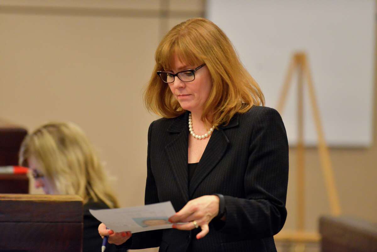 Prosecutor Catherine Hayes looks over information during the opening of the capital murder trial of Devin Fields. Fields is accussed of capital murder in the shooting death of Baby Girl Mshae Harrison.