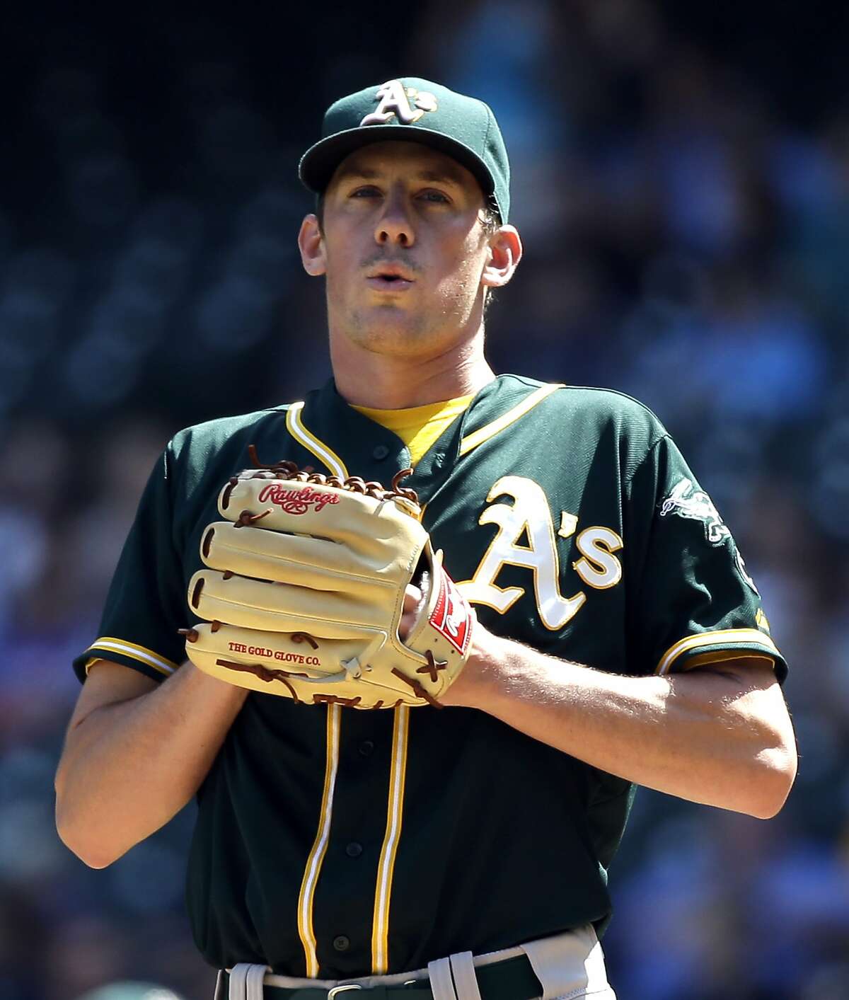 Oakland Athletics starting pitcher Chris Bassitt takes a breath after giving up the fourth of four runs to the Seattle Mariners in the first inning of a baseball game Wednesday, Aug. 26, 2015, in Seattle. (AP Photo/Elaine Thompson)