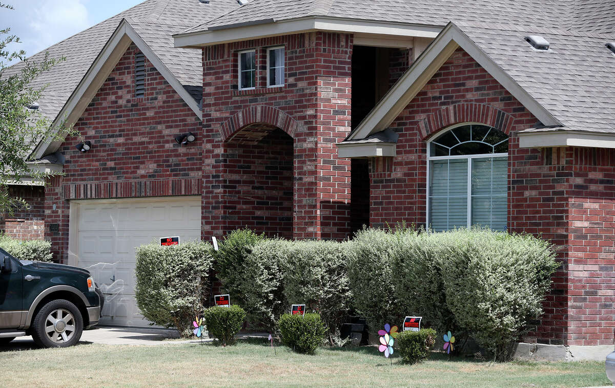 No trespassing signs are visible at the house located at 24414 Walnut Pass Tuesday September 1, 2015 where Bexar County Sheriff's deputies shot and killed Gilbert Flores,41, last Friday. The incident is currently being investigated.