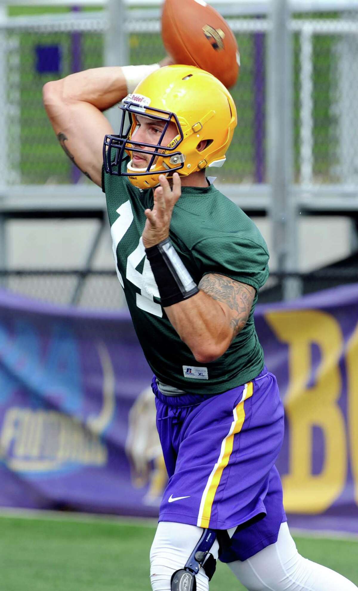 UAlbany quarterback DJ Crook throws the ball during the first football practice of the season on Friday, Aug. 7, 2015, at UAlbany in Albany, N.Y. (Cindy Schultz / Times Union)