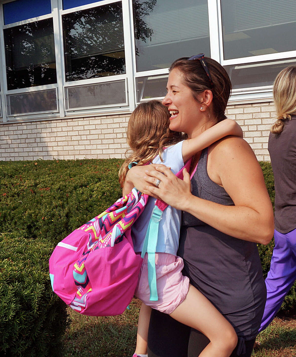 The hugs at the end of the first day at Sherman School were just as big as the ones at the start of the day Thursday.
