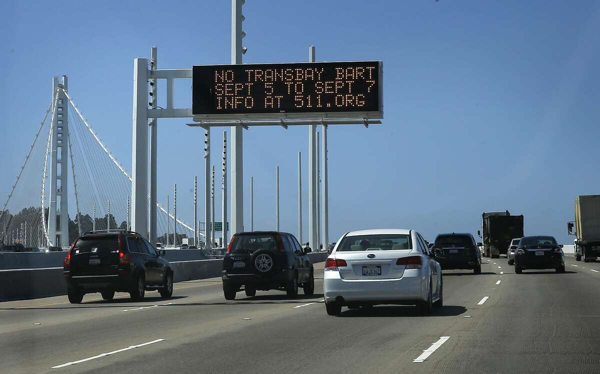 Warning signs are posted throughout the Bay Area notifying riders of this weekend's BART Transbay Tube closure, including on the Bay Bridge, in Oakland, Calif. as seen on Thurs. September 3, 2015.