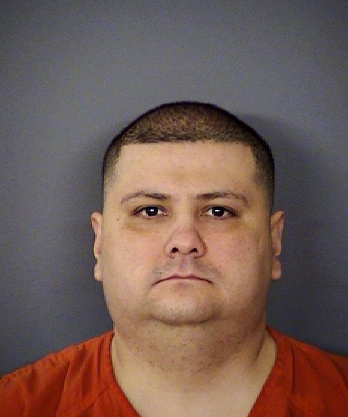 This undated handout photo provided by the Bexar County (Texas) Sheriff's Office, shows Gilbert Flores. Bexar County Sheriff Susan Pamerleau says Flores, who had his hands raised as if to surrender when deputies gunned him down was armed with a knife. She says the deputies believed Flores was holding the knife when they shot him and that investigators are reviewing video of the confrontation. (Bexar County Sheriff's Office, via AP)