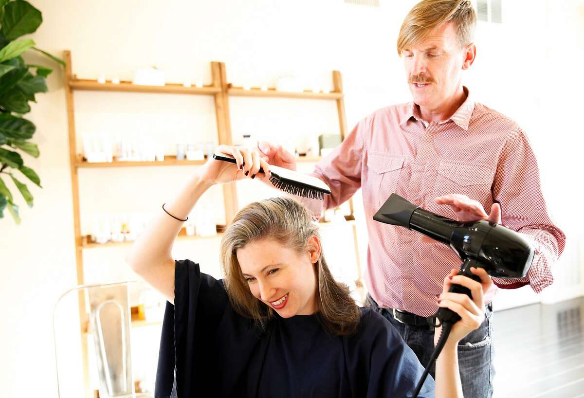 Hairstylist Bradley Crane gives a blowdry tutorial to Lisa McNabb at Ayla in San Francisco, Calif., on Thursday, September 3, 2015.