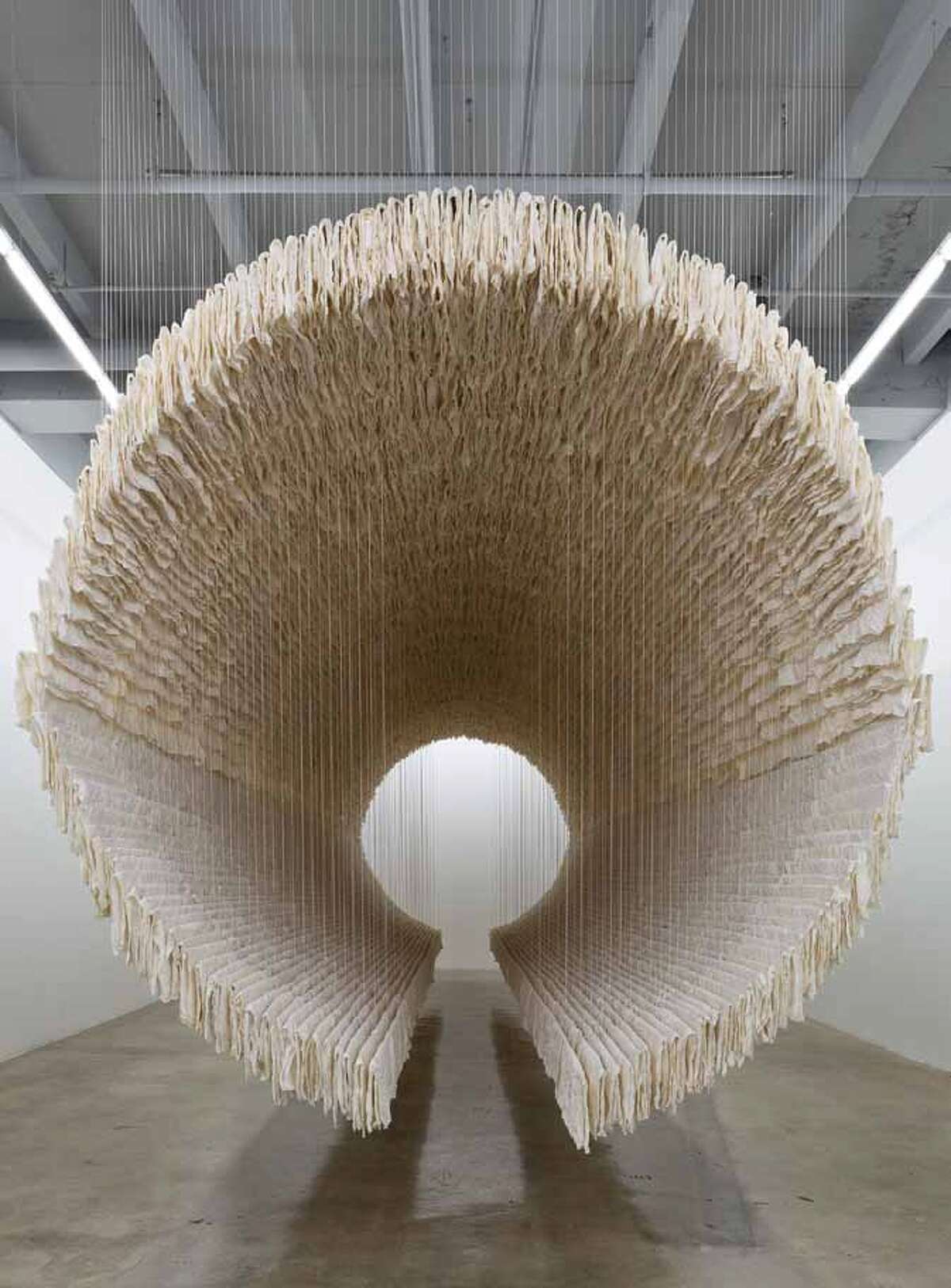 Zhu Jinshi’s 49-foot “Boat” comprises more than 8,500 sheets of calligraphy paper strung on bamboo rods and suspended from the ceiling with thread. It is part of the “28 Chinese” exhibit at San Antonio Museum of Art.