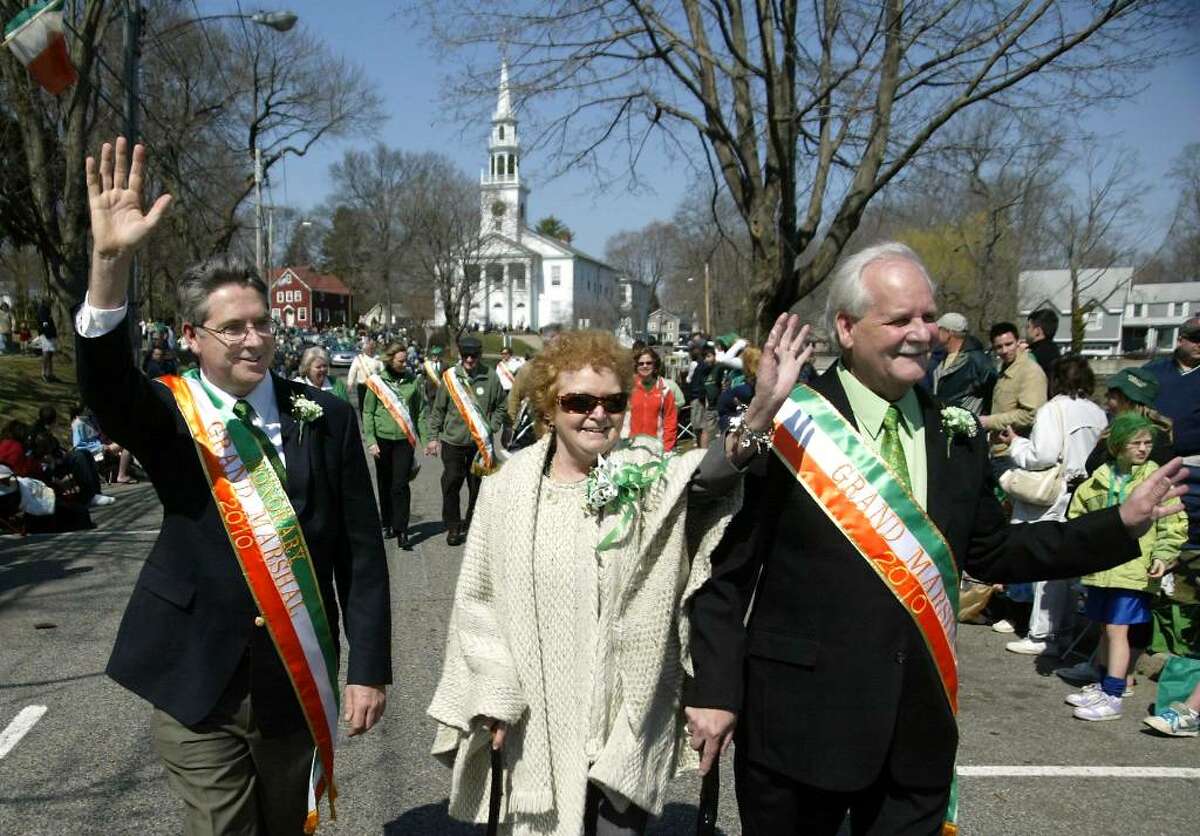 (L) Niall Burgess, Consul General of Ireland joins 2010 Milford St. Patrick's Day Parade, (R) Grand Marshall Martin Hardiman and his wife Mary, Sunday, March 21, 2010, marching along the parade route near Milford Town Hall.