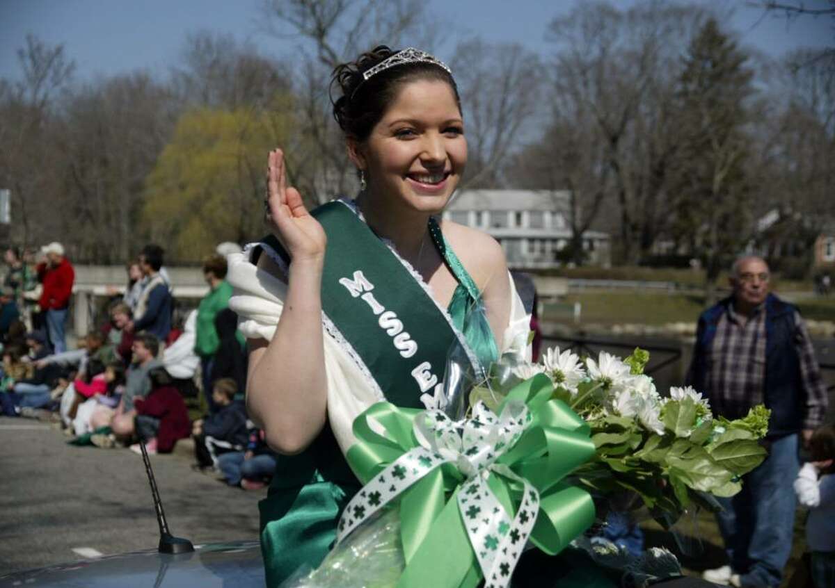 Miss Emerald Isle, Carla Marie Lynch waves to the crowds, Sun., March 21, 2010, as she rides along the Milford St. Patrick's Day Parade route in Milford.