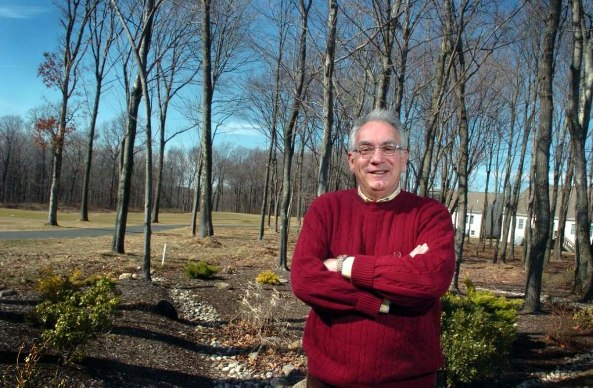 Peter Bunzl stands in the backyard of his Oxford Greens home, overlooking the 14th hole of the golf course. Bunzl moved from Westchester County a few years ago with his wife who fell in love with the atmosphere in Oxford.