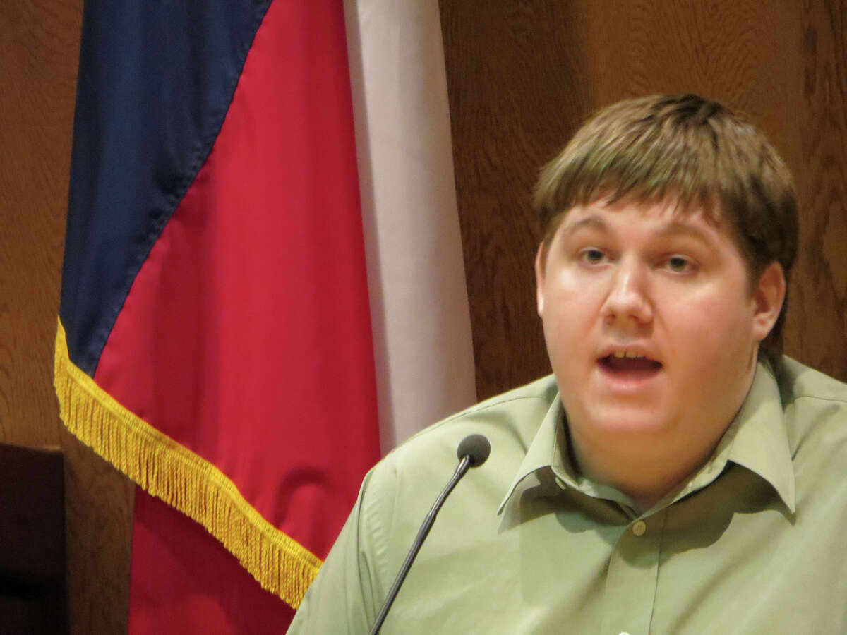 Justin Carter testifies at pre-trial hearing in Comal County on Aug. 27, 2014. Carter is charged with making a terroristic threat over a Feb. 13, 2013 Facebook entry in which he wrote about shooting up a kindergarten and eating the beating heart of one of his victims. He claims he was joking.