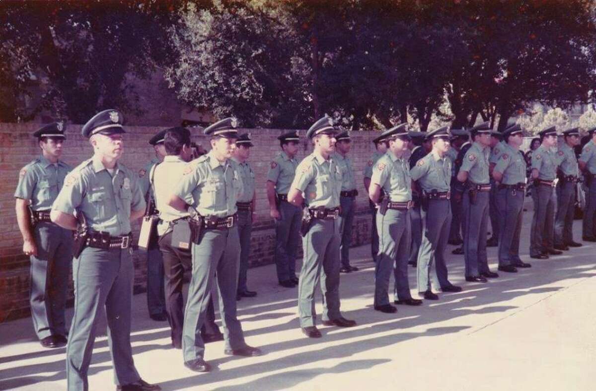 A class of graduating SAPD cadets, possibly from 1985, lines up in formation. Click through to see a hand-picked selection of startling archive photos from San Antonio's true crime past.